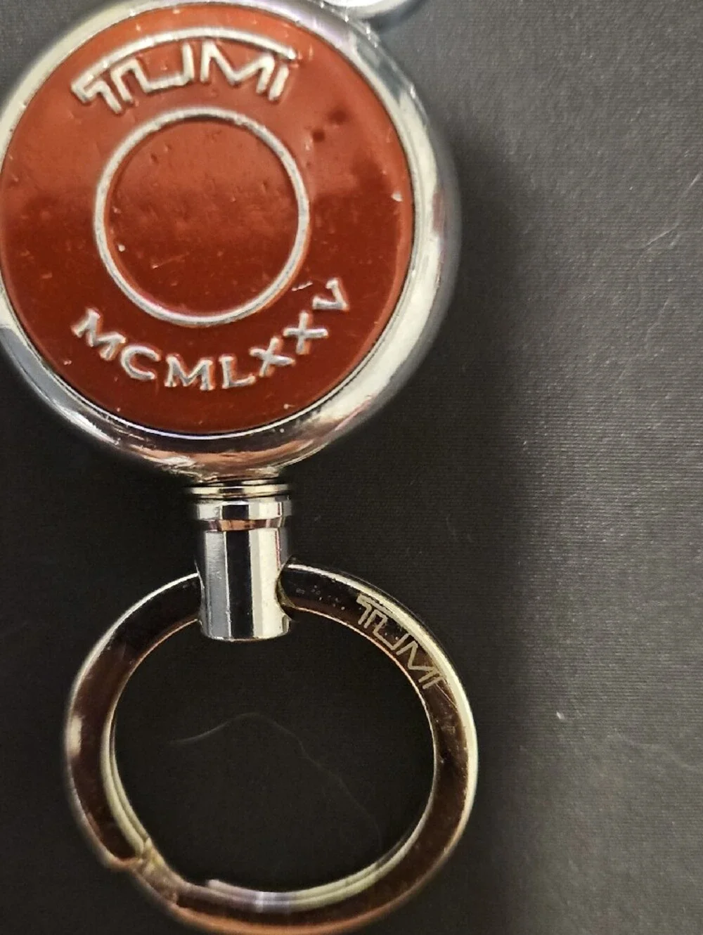 Tumi Orange Round Key Fob with Silver Hardware-retractable